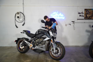 Electric motorcycle being cleaned