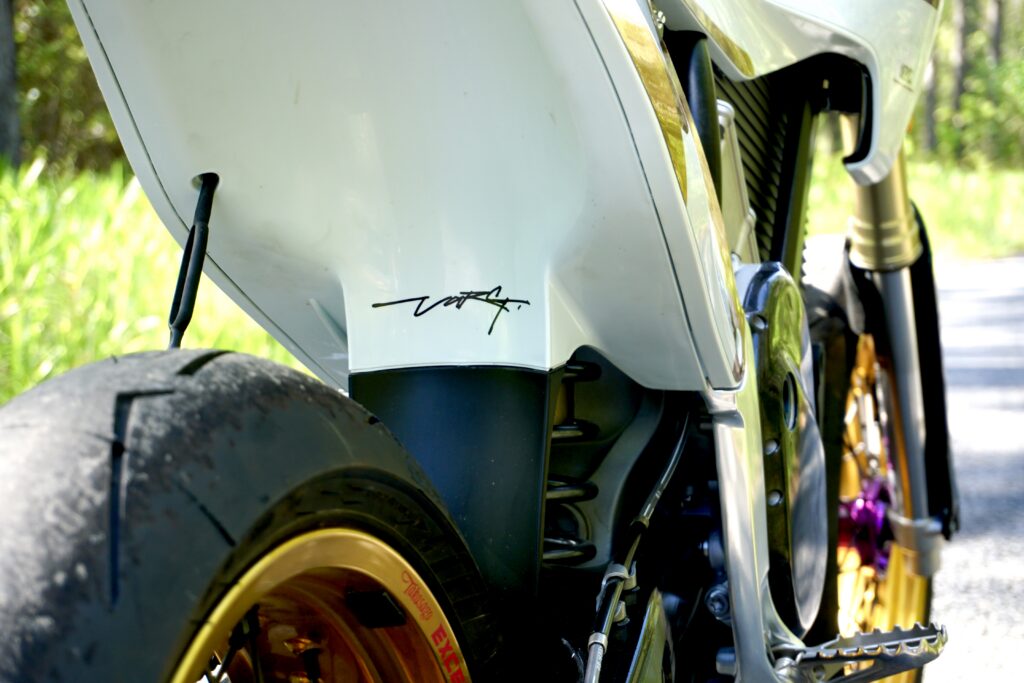 close up photo of the rear section of the stark ex converted to a supermoto.
This features the seamless mud guard section of the factory fender with hints of custom work